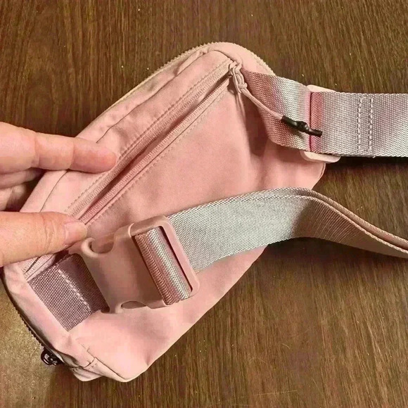 Light Pink Fanny Bag. Zip Closure. Pockets. Adjustable. 5”x9”. - Picture 5 of 8